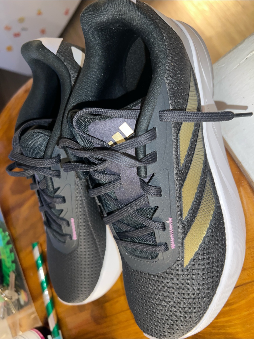 Adidas Women’s Black and Gold Striped Sneakers